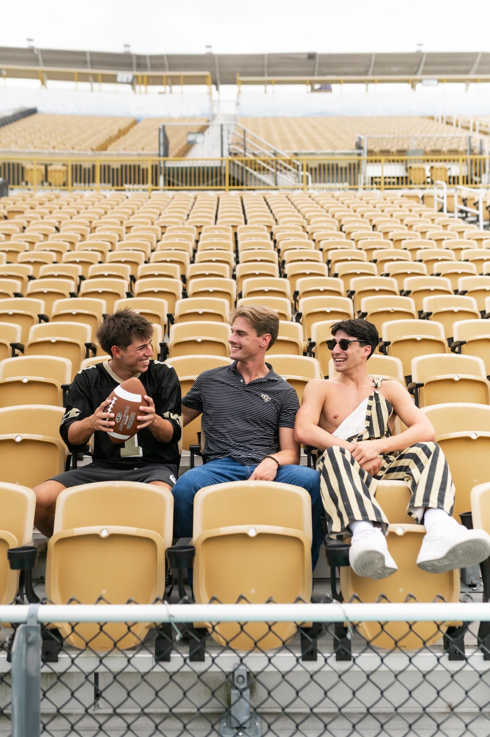 college football fans in stadium seating scaled
