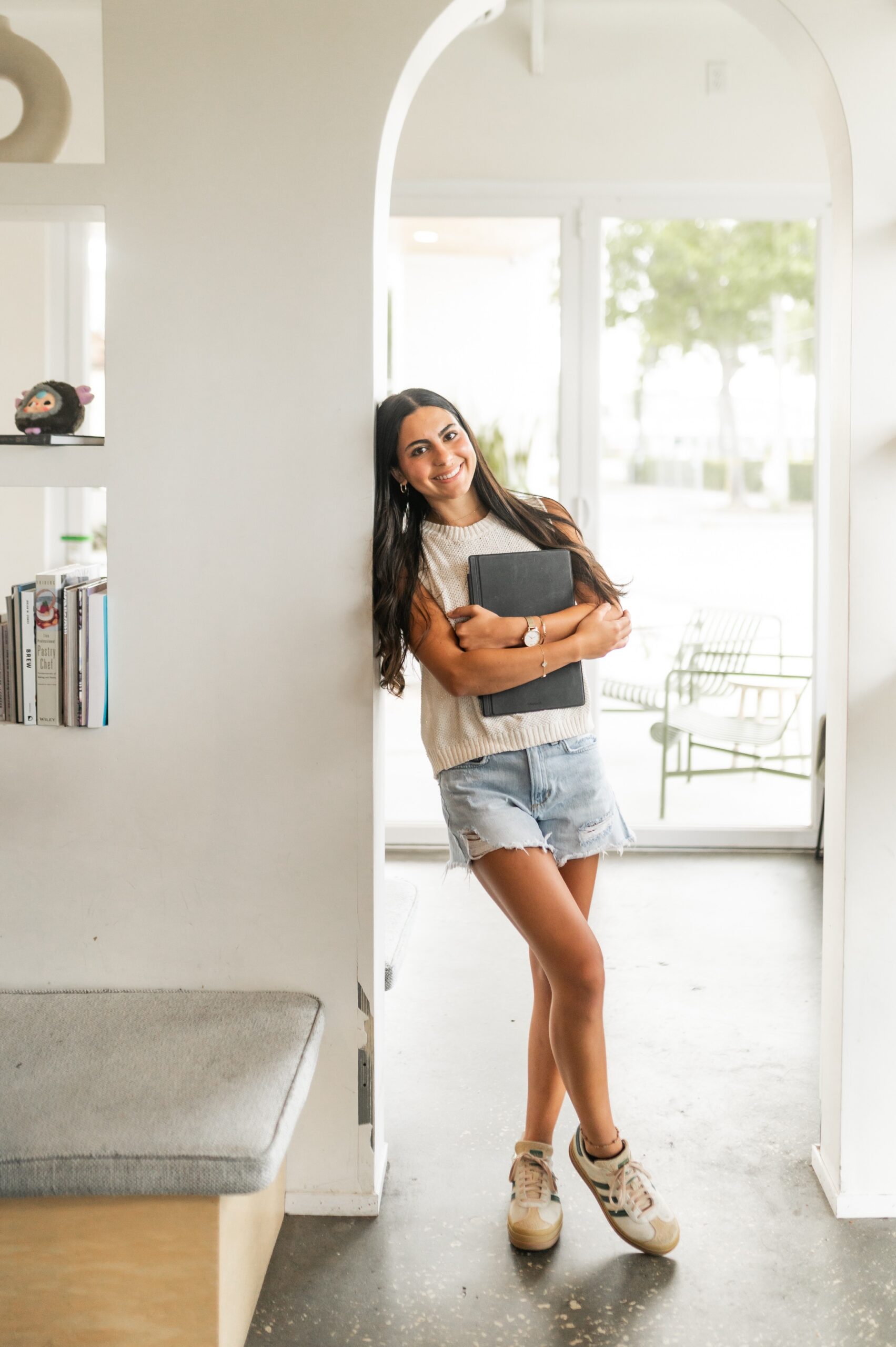creative freelancer posing in office doorway scaled