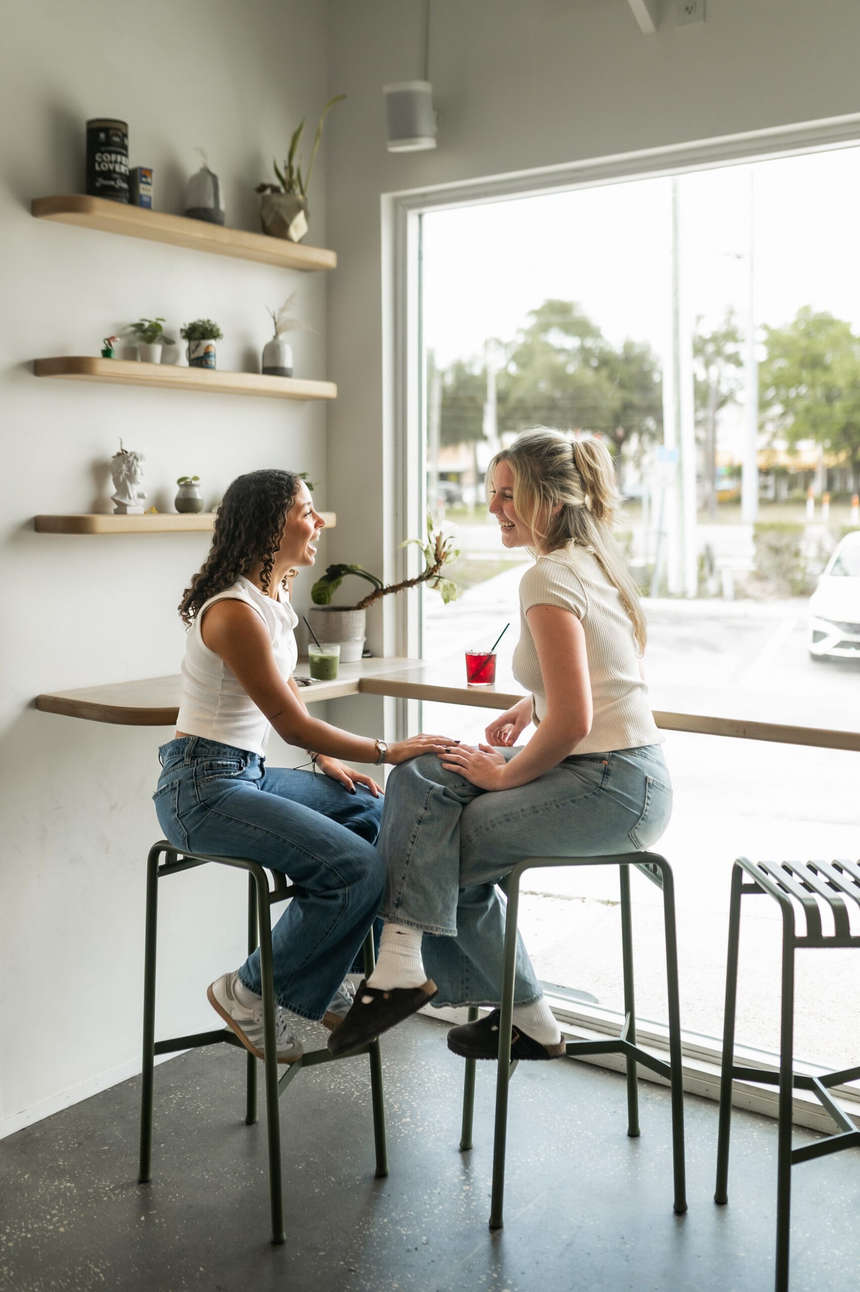 friends socializing at window counter scaled