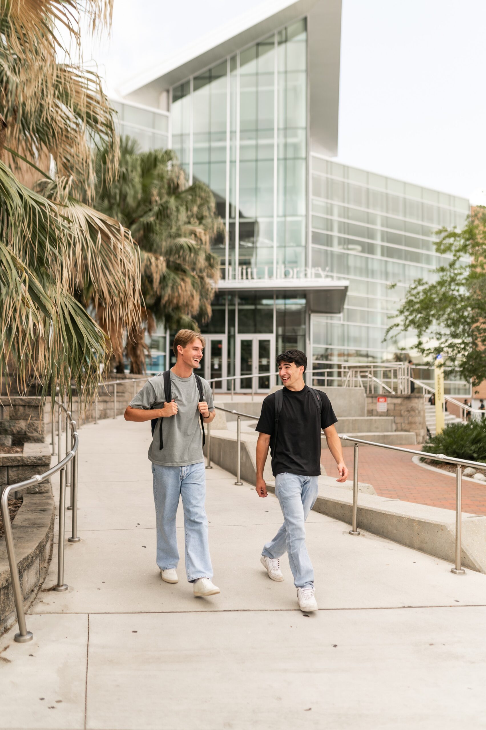 students walking on university campus pathway scaled