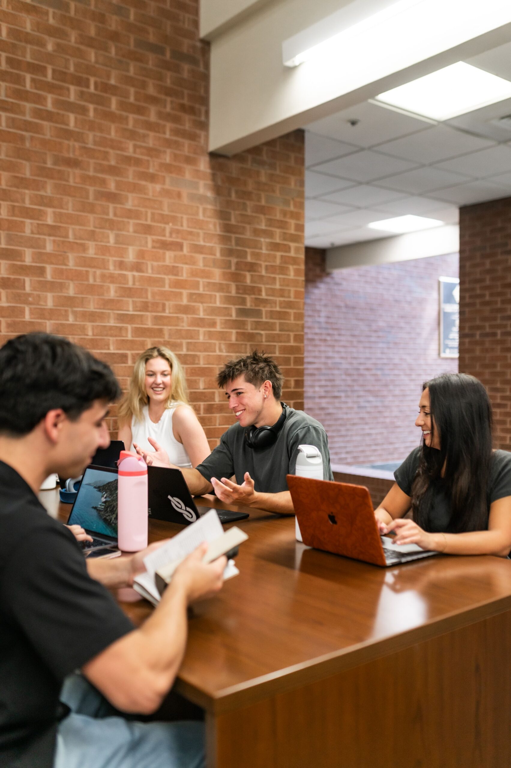 university students collaborating in study lounge scaled