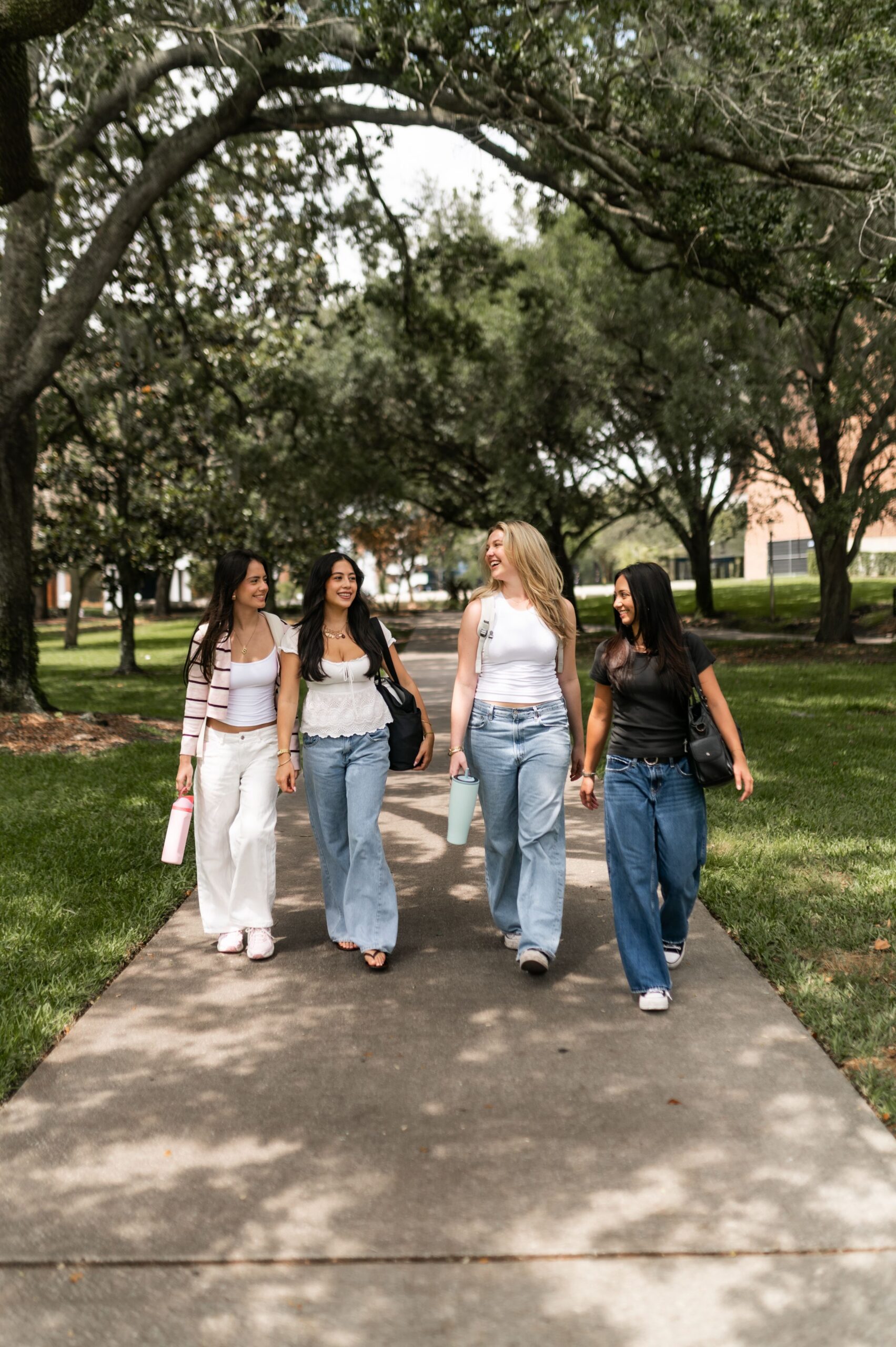 university students walking on campus walkway scaled