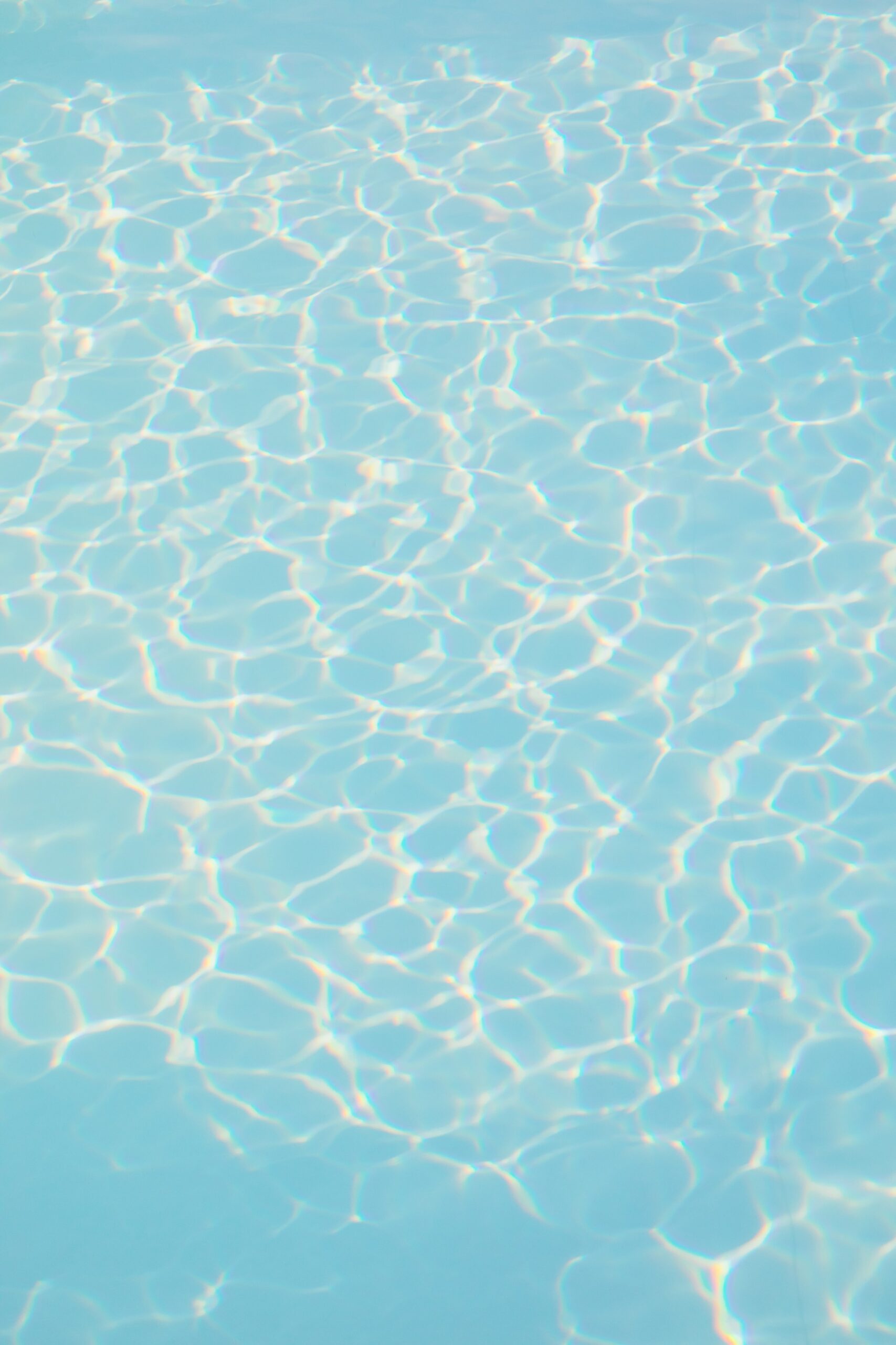 Rippled sunlight on the bottom of a swimming pool scaled